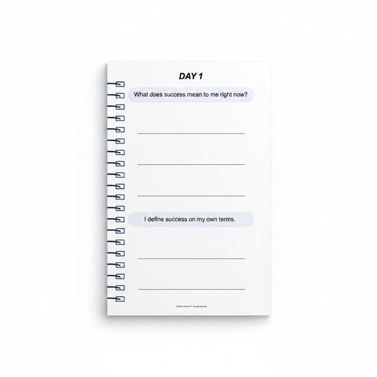 The J.M Press Affirmed In Business Pocket Diary Volume One, a white spiral-bound journal with prompts for defining success.