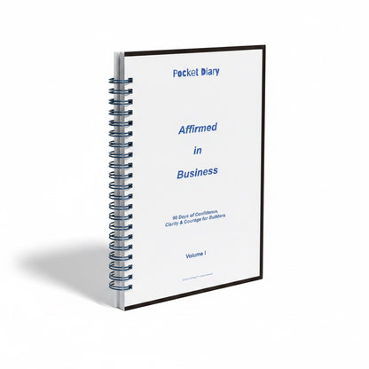 The J.M Press Affirmed In Business Pocket Diary Volume One, a spiral-bound journal with a white cover and blue text.
